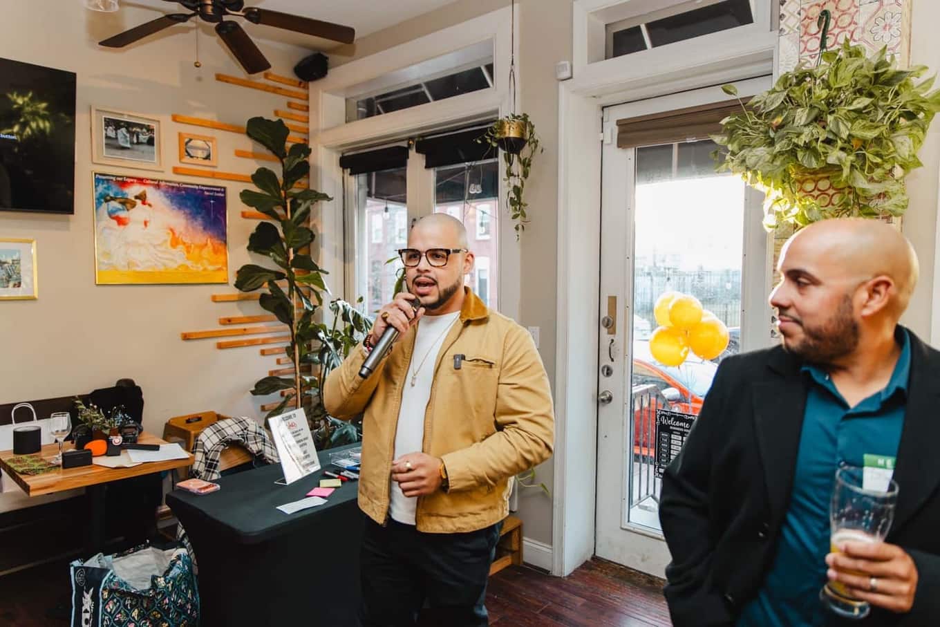 Guests gathered near the bar at the first Colado Latino Network event at Bodega and Vino